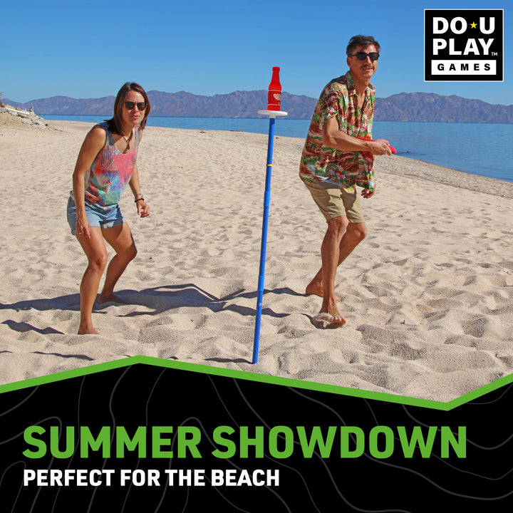 Two players competing in BashNet beach game with red scoring bottle and blue measuring pole on sandy shore