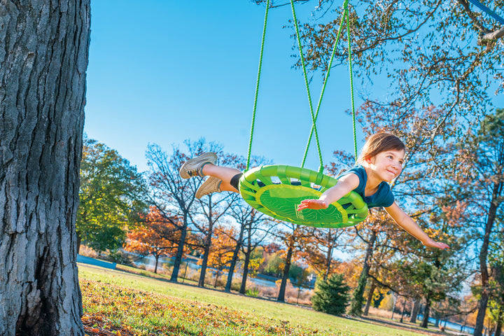 kid on explorer tree swing on slackline
