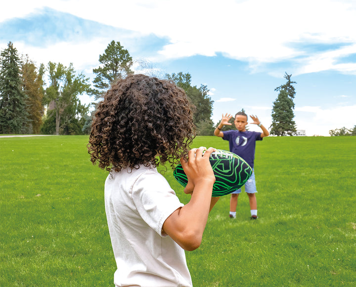playing with p1 warrior football in a field
