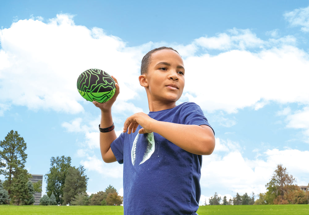 kid playing with p1 warrior football