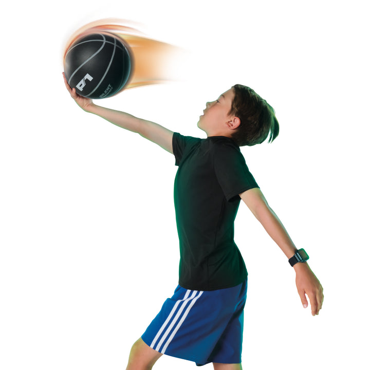 Player practicing a basketball layup with the black P1 Silent Shot ball
